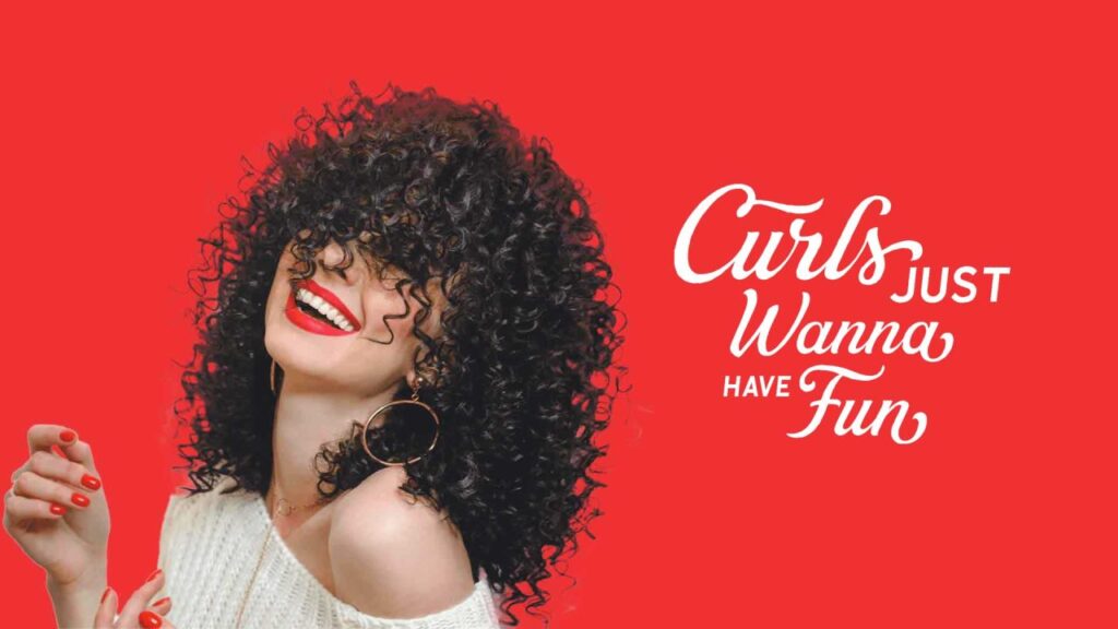 Curly hair woman on a red background