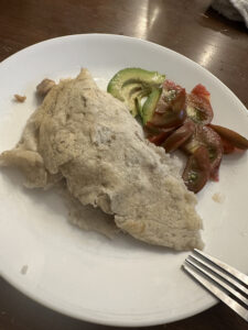 Stuffed batata tortilla with an avocado salad